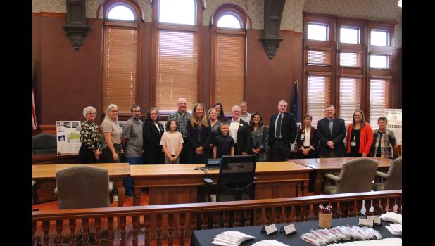 Local healthcare providers, partners and supporters gather for a photo with Indiana State Health Commissioner Dr. Lindsay Weaver after a special community session at the Pulaski County Courthouse on Friday, Oct. 9. 