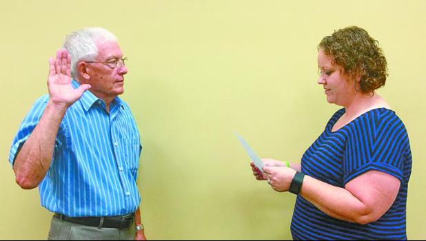 Photo Submitted by Christi Hoffa Alvin Parish was sworn into office by Pulaski County Clerk Christi Hoffa after he was selected to fill a Winamac Council seat on July 25.