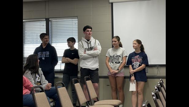 Photo by Megan Galbreath Eighth graders Hutch Martin, Kannon Hoover, Evan Burgess, Ava Malchow and Addyson Hines regularly share highlights from both sports and academic teams on the radio.