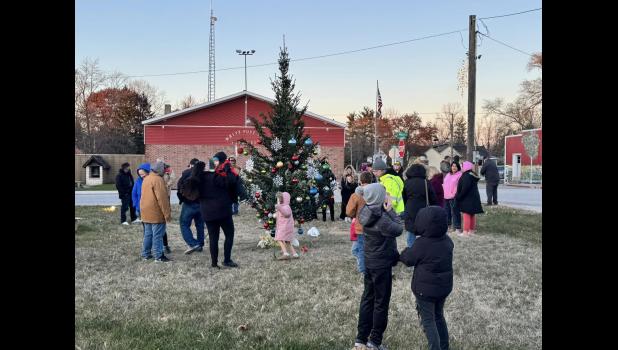 Photo provided. The chilly temperatures didn’t stop the Medaryville community from coming out to decorate the town Christmas tree on Sunday, Dec. 1.