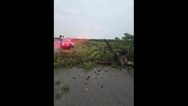 Photo provided. Pulaski County deputies assisted in clearing trees to help keep roads open on Tuesday, Aug. 11.
