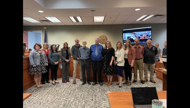 Photo by Megan Galbreath The Pulaski County Veterans Treatment Court team congratulates the two newest graduates on their hard work.
