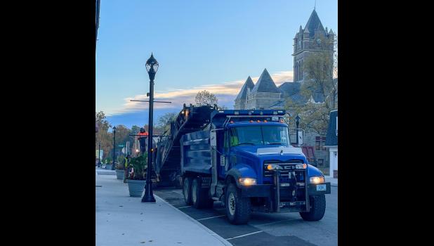 Photo by Megan Galbreath The Pulaski County Highway Department collects street millings on Main Street on Thursday, Oct. 30.