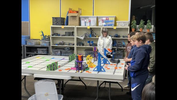 Photo by Megan Galbreath The Eastern Pulaski VEX Robotics team gave a robotics demonstration during a regular school board meeting on Dec. 12.
