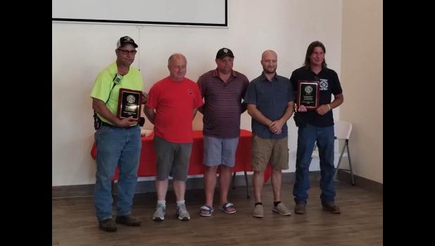 Bill Weaver is pictured on the far left, while Larry Weaver is pictured on the far right.