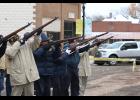 Braving the cold temperatures, a gun salute is fired by members of the American Legion and VFW.