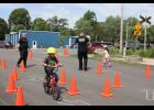 Round and round they go! Deputy JT Martin and Lieutenant Brett Funk watch as their riders zip through the course.