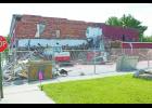 After a year of looking at an eyesore, Monterey residents are seeing the collapsed portion of the Sportsman’s Bar and Grill cleaned up.
